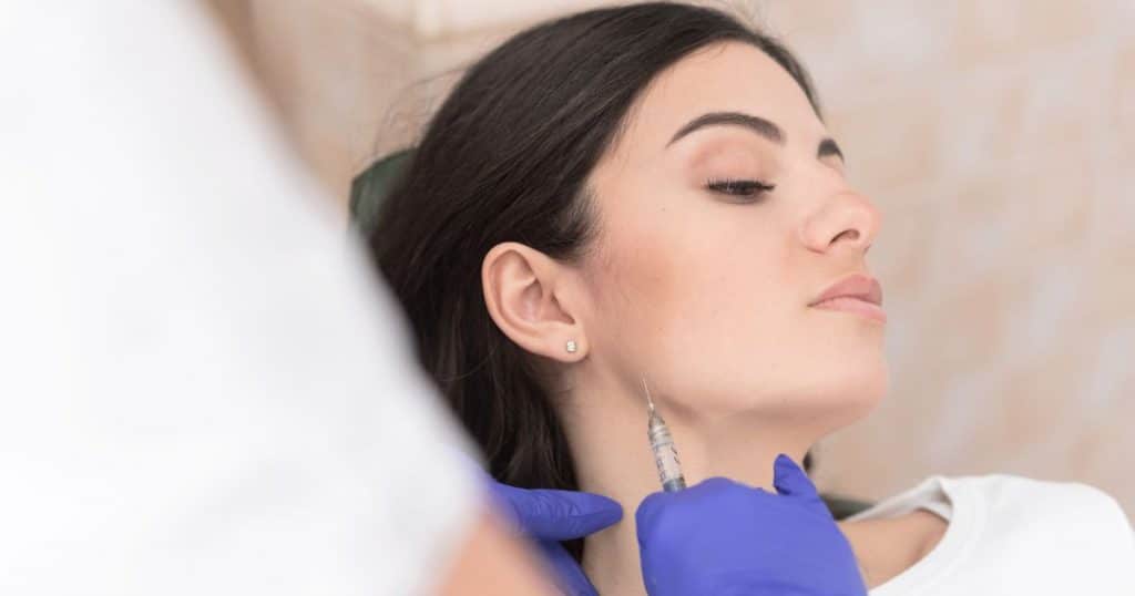 woman undergoing facial procedure