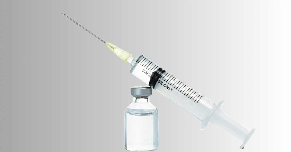 a vial with a syringe