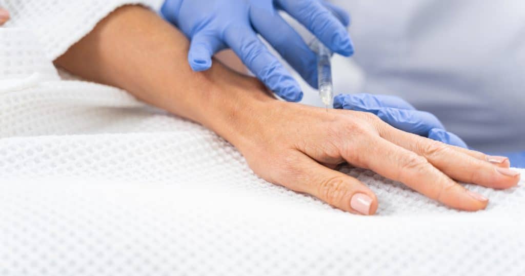 image of someone getting dermal fillers in the hands