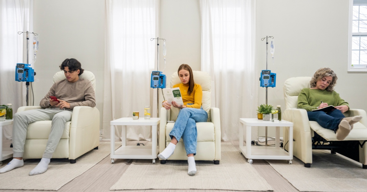 People receiving IV drips in a wellness clinic.