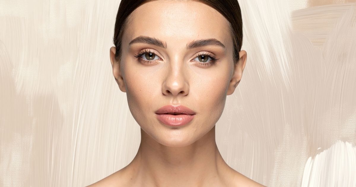 Close-up portrait of a woman with smooth, hydrated-looking skin.